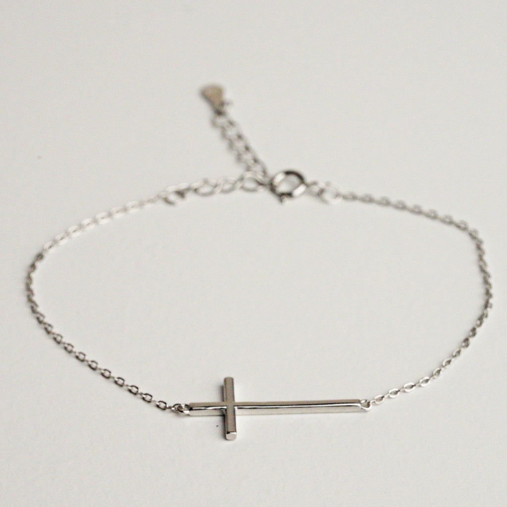 Silver cross sale bracelet sideways